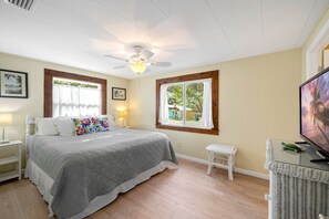 The main bedroom is spacious with a comfortable king bed