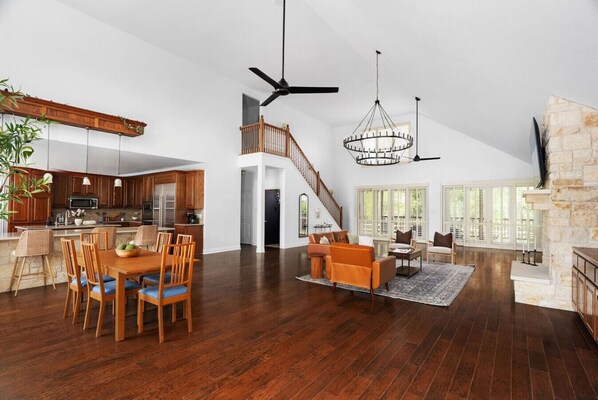 Gather, cook, and relax in this spacious open floor plan featuring hardwood floors, soaring ceilings, and tons of natural light.
