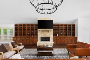 Gather ‘round the stone fireplace! Cozy up with your favorite shows on the big-screen TV or just enjoy great conversation by the fire.