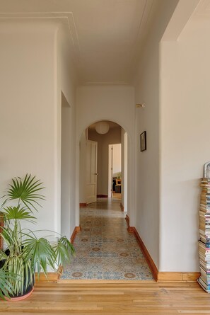 Hallway from living room to kitchen, dining and bedrooms. 