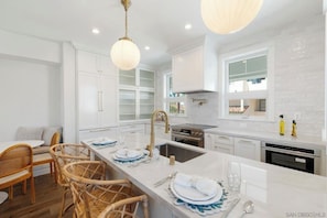 Top of the line kitchen with Bosch appliances. Fully stocked.