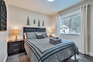 Wake up to pine tree views and soft morning light in this cozy retreat.