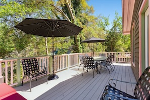 The upstairs deck is perfect for relaxing with plenty of seating.