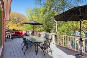 The upstairs deck is perfect for relaxing with plenty of seating.