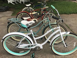 The garage is full of bikes for all ages to ride in the quiet neighborhood.
