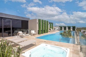 Indulge in our rooftop pool & hot tub with breathtaking ocean views! 


