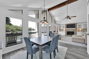 Wall of windows offering panoramic lake views