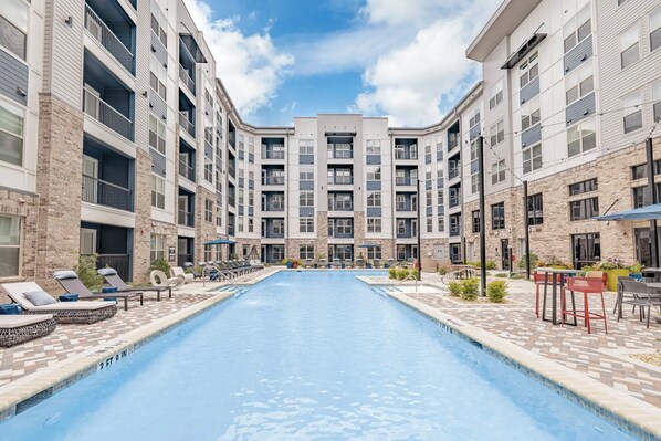 Huge outdoor pool with plenty of spots to lounge and hangout!