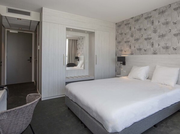 Unit with 2 Single Beds. Exact unit will be assigned upon arrival. Views, colors, and decor may vary.