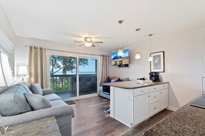 Nice sleeper sofa in living room and open floor plan.  All TVs are smart ready fro you to enjoy your favorite streaming programs.  