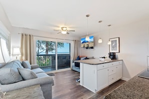 Nice sleeper sofa in living room and open floor plan. All TVs are smart ready fro you to enjoy your favorite streaming programs.