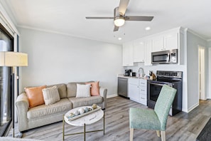 Furnishings contribute to the room's functionality, offering both comfort and practicality.