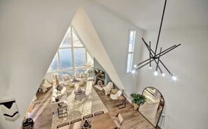 Lake views that inspire. Unwind in the airy and bright living room of The Waterfront Chalet