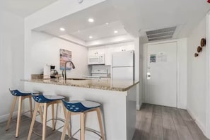 Fully Stocked Kitchen. Blender, Toaster, Waffle iron, Mixer, Coffee maker with drip and k-cup, pots, pans, utensils, dishwasher, cupcake pan, mixing bowls, plates, bowls, mugs, and cups. Children's utensils, plates, cups, and bowls. And more