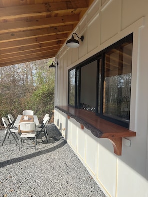 Live oak outside bar with plenty of seating