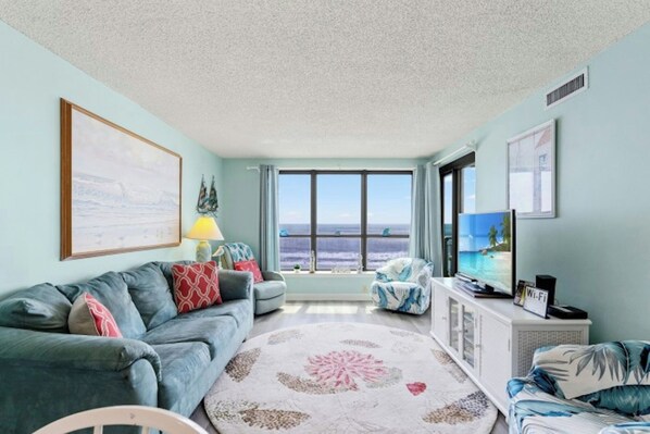 The oceanfront living room is well-appointed with comfortable furnishings.