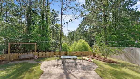 Step into the cozy, fenced-in back yard for some fresh air!