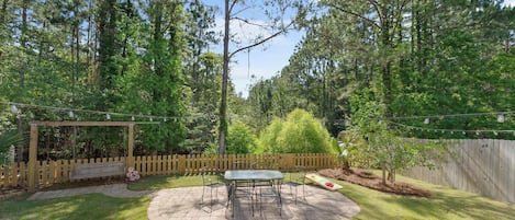 Step into the cozy, fenced-in back yard for some fresh air!
