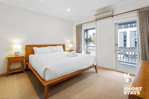 Main bedroom with ensuite bathroom, walkin wardrobe and private balcony