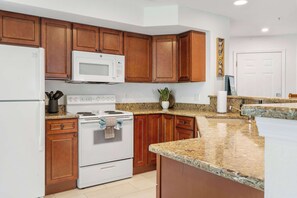 The open kitchen offers ample space & all the comforts of home