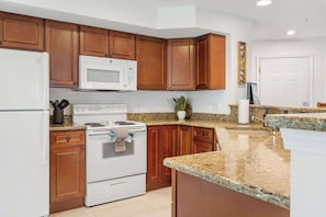 The open kitchen offers ample space & all the comforts of home