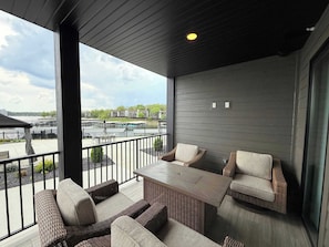 Wrap around deck with outdoor seating, grill, and fire pit