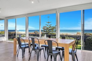 Dine against a backdrop of endless blue—the spacious dining area ensures every meal is accompanied by sparkling coastal views.