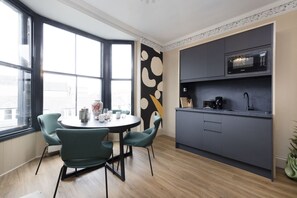 Studio with bed and kitchen