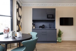 Studio with bed and kitchen