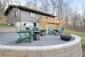 Relax and unwind in the backyard area, complete with a firepit and hot tub just steps away.