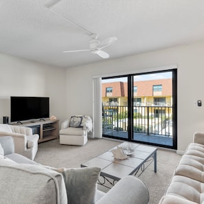 Curl up in the serene living room & stream all your favorite entertainment