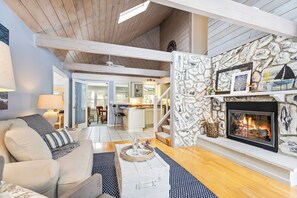 The living area offers views of the dining room, creating an open and connected space.