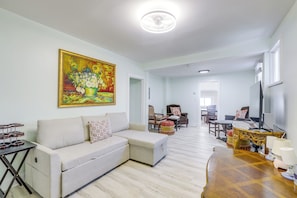 Living Room | Window A/C Units | Queen Sleeper Sofa | 1st Floor