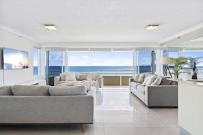 Spacious and cozy living area overlooking the ocean