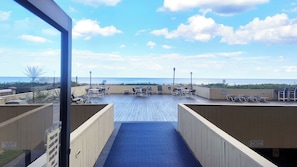 Walk down the hall and out the door to the Pool Deck and Beach!