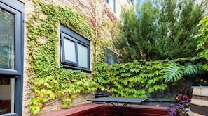 Outdoor leafy patio, perfect for unwinding.