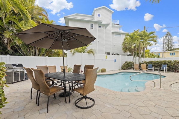 Pool and Patio with grill, Al Fresco dining table and poolside seating.