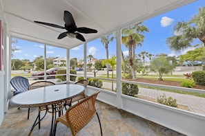 Screened Balcony with table and chairs