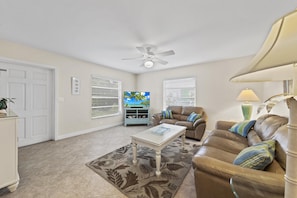 Living Room with ample seating. Main entrance door shown