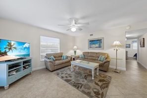 Living room with Large flat screened television.