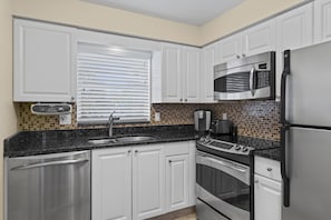 Thoughtfully designed kitchen with modern appliances.