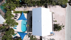 Aerial View of entire unit with front and back pool and patio.