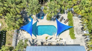 Aerial view of pool and patio. Shade sails additional comfort.
