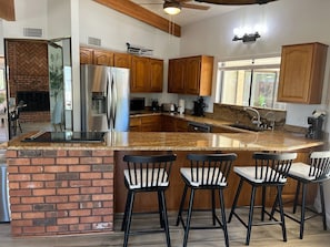 Modern kitchen includes counter seating and everything your chef needs.