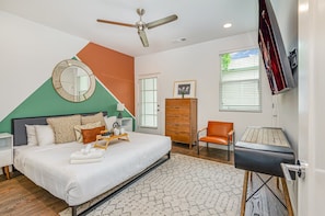 Spacious suite with a king bed, Smart TV, walk-in closet, private balcony, and en-suite bath.