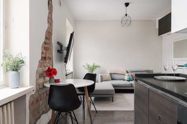 Open-plan living space with warm lighting and a calming neutral palette for a true home-away-from-home.