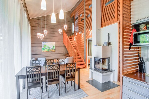 Cozy living area with fireplace and dining space in an open layout