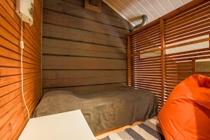 Loft area with a snug 90 cm bed — a peaceful place for one guest.