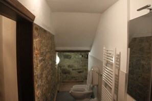 Wall, Flooring, Floor, Room, Ceiling, Plumbing Fixture, Stone Wall, Tile, Wood Stain, Plumbing