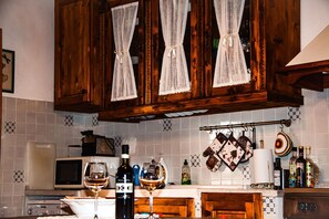 Wood, Interior Design, Kitchen, Cabinetry, Lighting, Furniture, Countertop, Brown, Light Fixture, Room